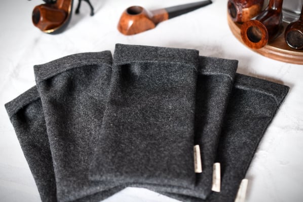 five pipe socks with pipes in the background